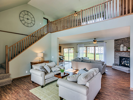 Stairs leading to an open area and the bedrooms and bath for this custom modular home 